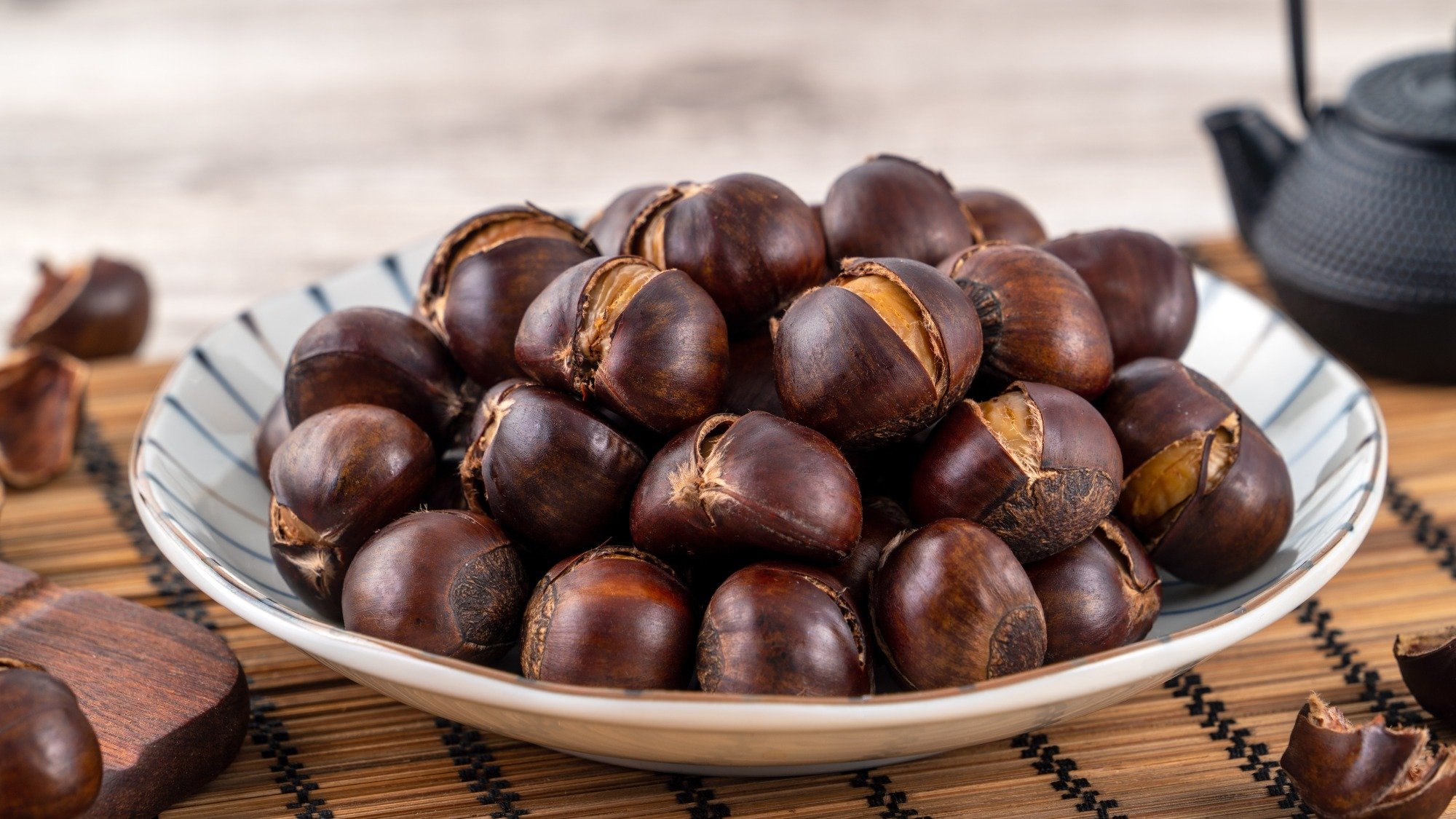 Roasted chestnuts in a bowl.