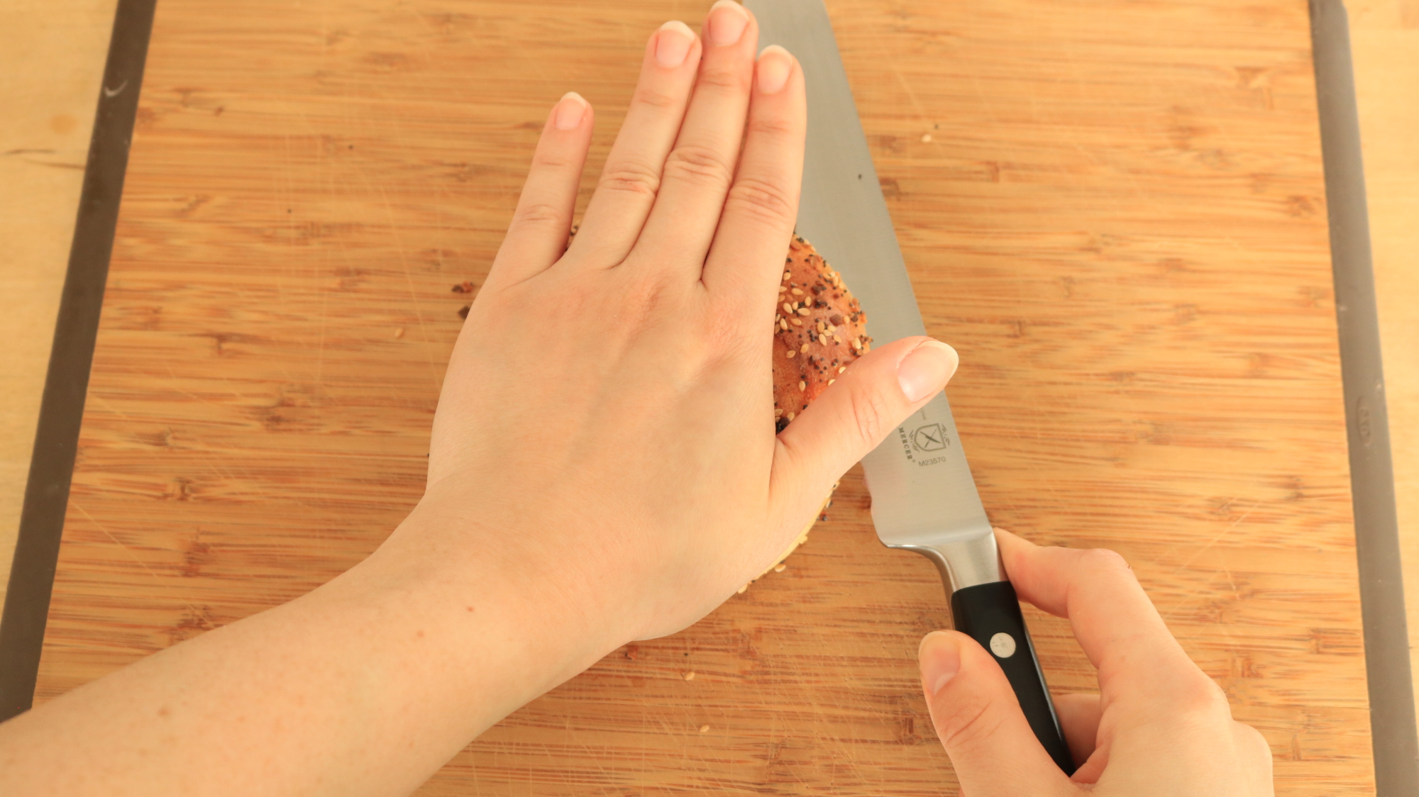 Hand turning bagel