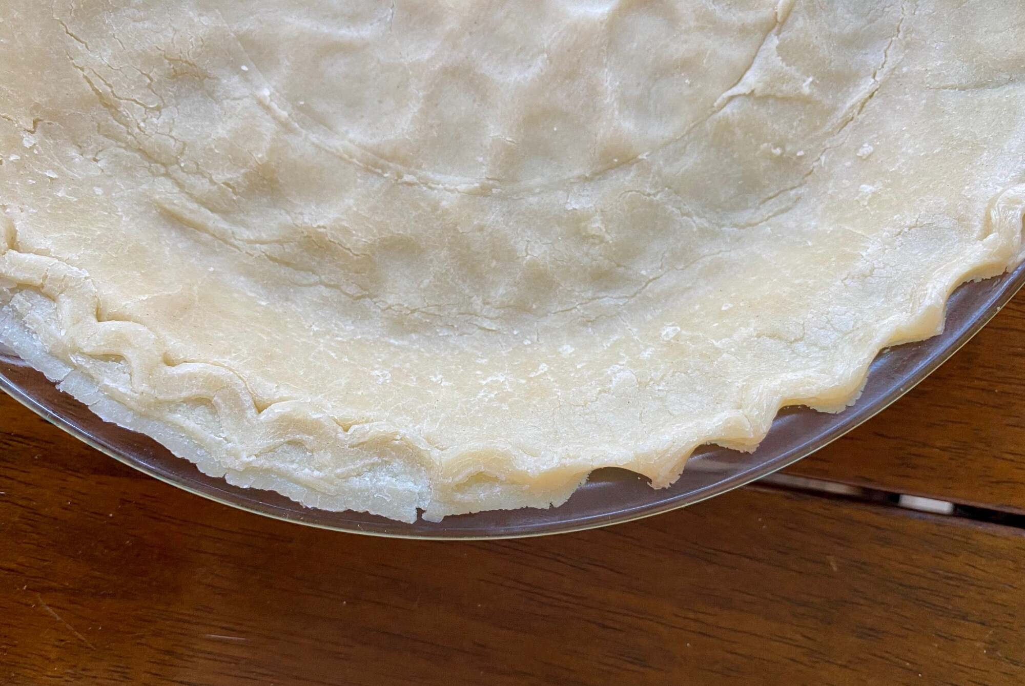 A pie crust with the edge crimped.