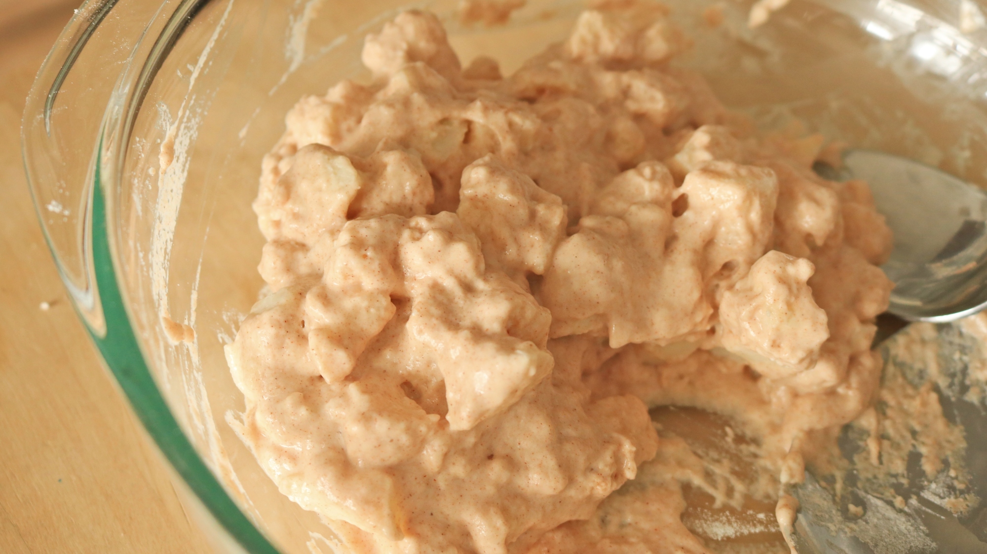 Apple fritter batter in a bowl.