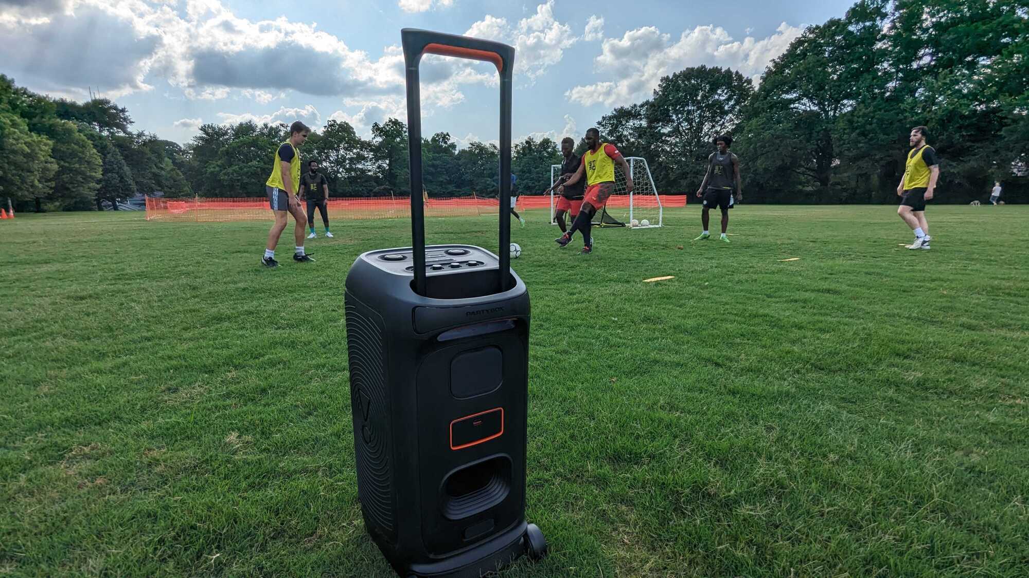 JBL PartyBox Stage 320 in soccer field.