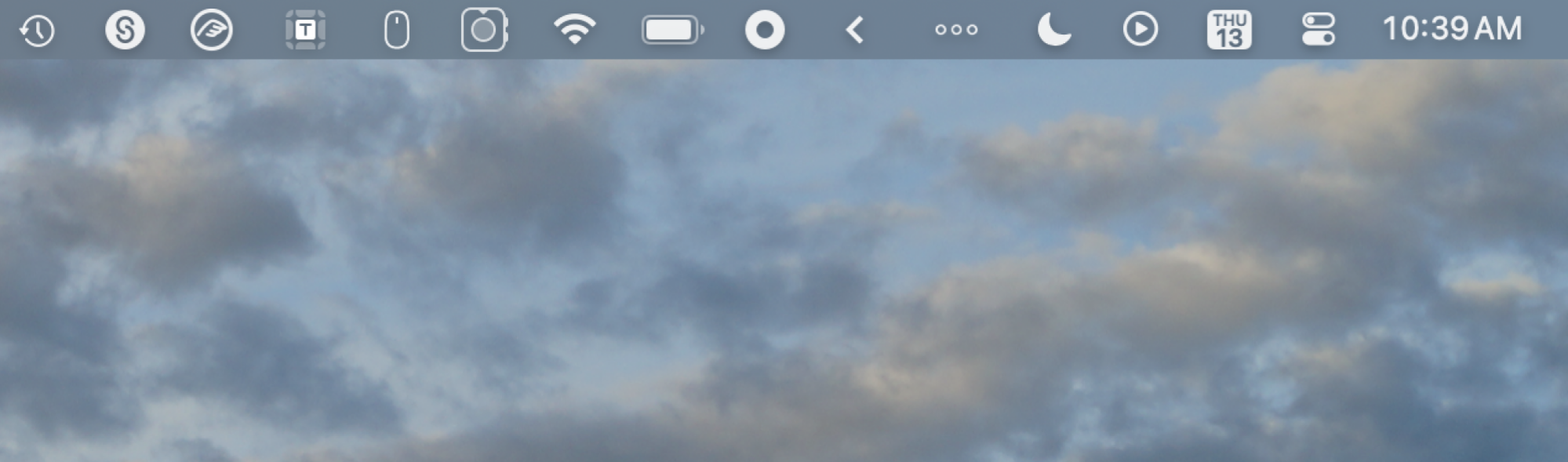 A messy menu bar. One icon is an arrow pointing left—everything to the left of it is normally hidden.